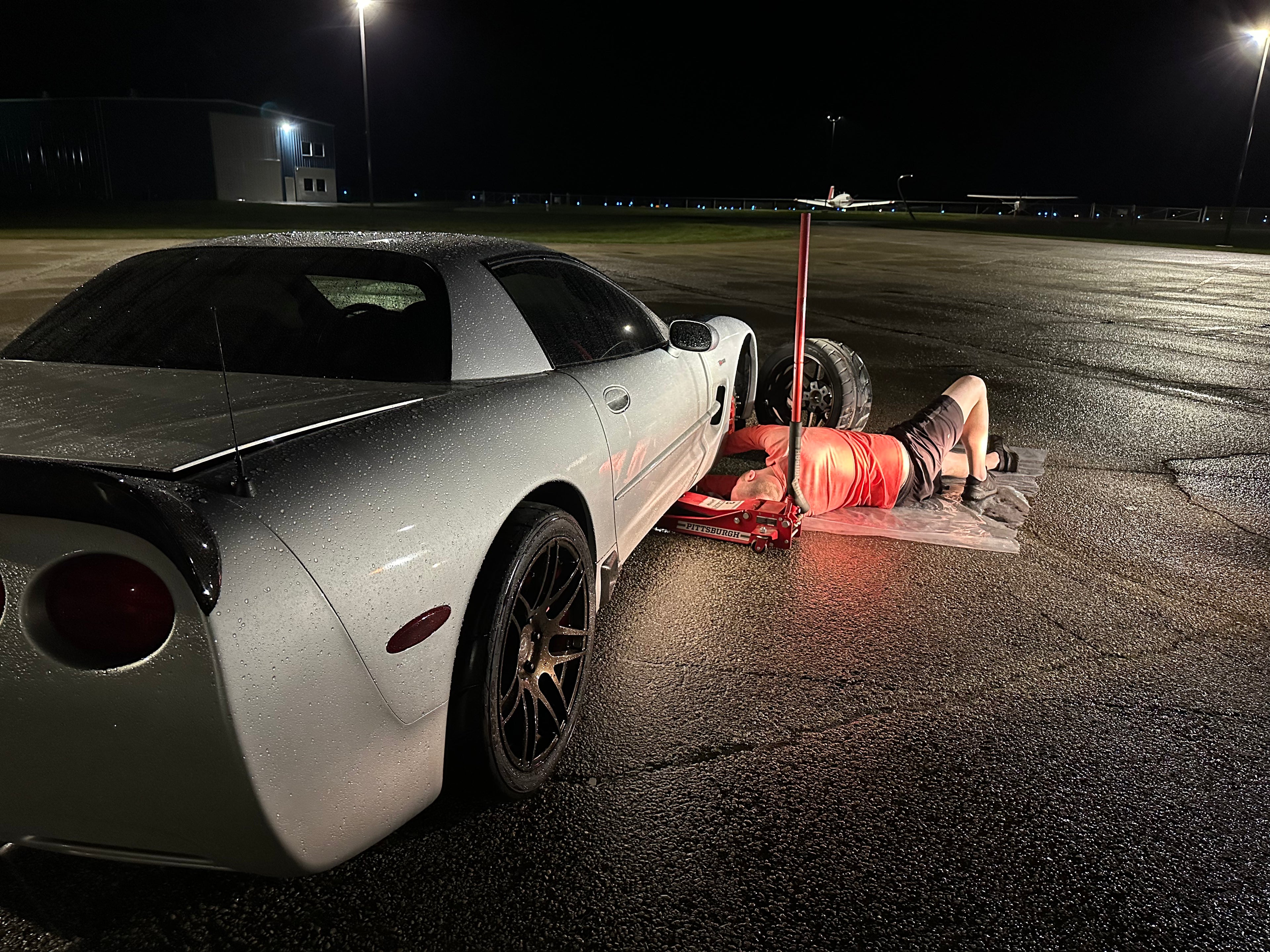 Caleb Wisher working under a Corvette during early tuning development
